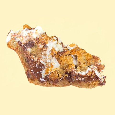 A rich S’mores-inspired cookie crust packed with Nutella, gooey marshmallows, marshmallow fluff, s’mores cookie dough, and crunchy graham cracker crust pieces. Finished with fluffy whipped topping, a silky Nutella drizzle, and even more graham cracker goodness.
